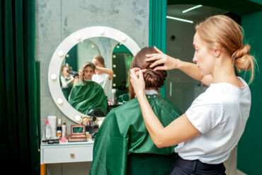 professional-hairdresser-makes-hairstyle-woman-beauty-salon