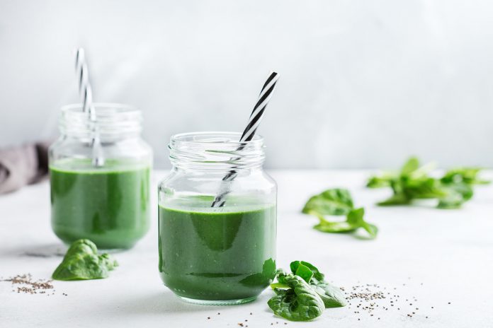 Healthy green vegan smoothie with spinach, spirulina and chia seeds