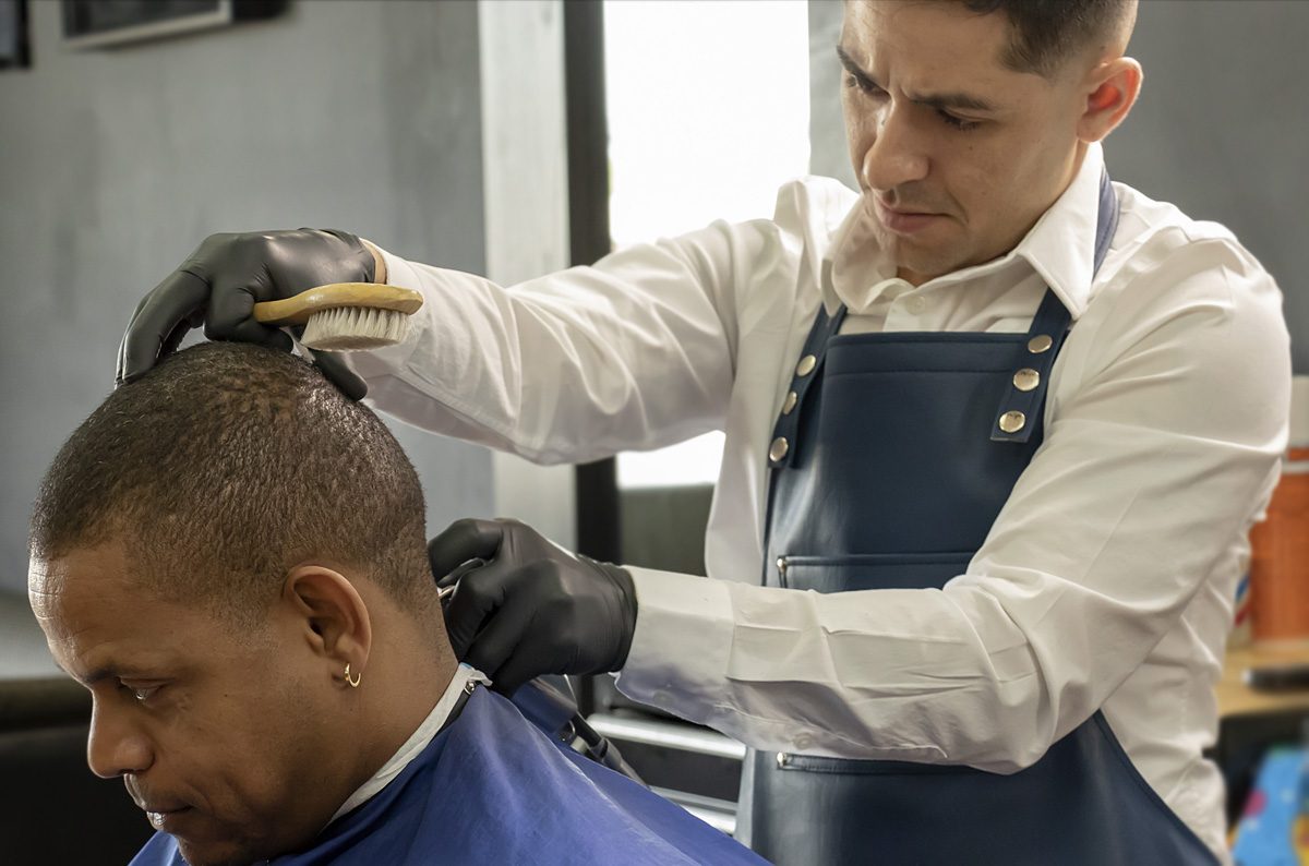 Barber giving a cut